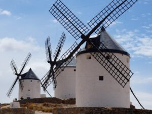 Picturesque scene of historic Spanish windmills under a clear sky.
