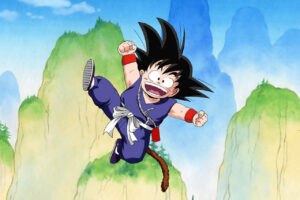 Goku de Dragon Ball saltando con alegría en un paisaje montañoso